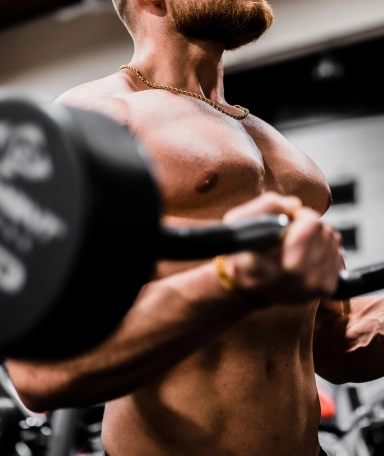 Muscular man lifting weight